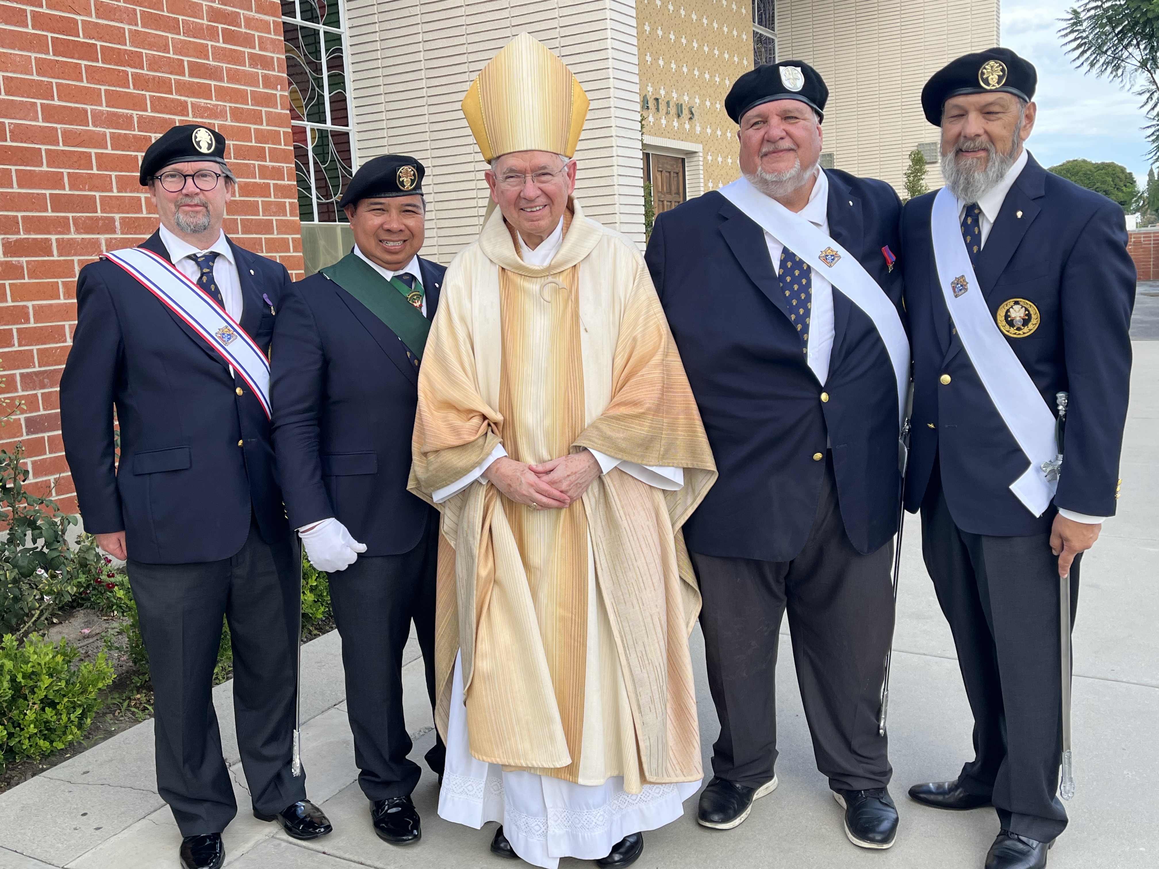 Archbishop José H. Gomez with four Knights of Columbus members after the altar dedication Mass